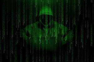 ハッカーが悪だくみしているイメージ画像